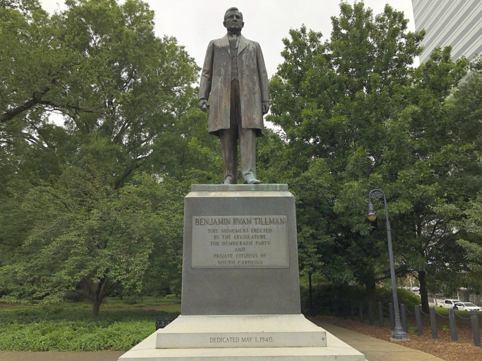 A statue of "Pitchfork" Ben Tillman is seen outside the South Carolina Statehouse on Tuesday, June 16, 2020, in Columbia, South Carolina. Tillman, who was white, led a race riot that killed four black men in 1876. Some activists want his statue removed and Clemson University wants to remove his name from a main campus building. (AP Photo/Jeffrey Collins)