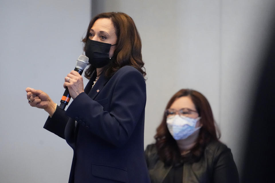 Vice President Kamala Harris speaks during a visit to a COVID-19 vaccination site Tuesday, April 6, 2021, in Chicago. The site is a partnership between the City of Chicago and the Chicago Federation of Labor. Sen. Tammy Duckworth, D-Ill., listens at right. (AP Photo/Jacquelyn Martin)
