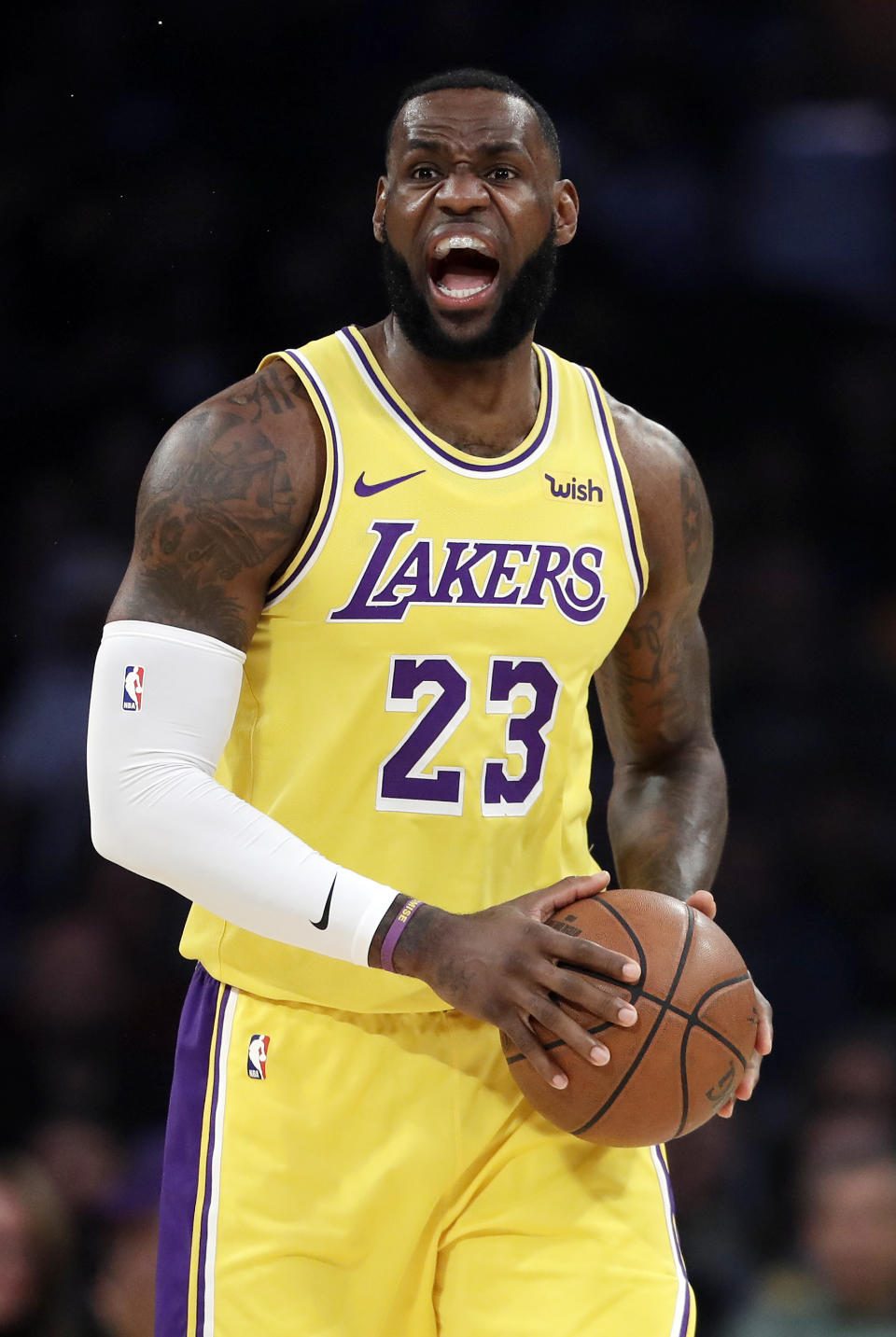 Los Angeles Lakers' LeBron James yells during the first half of the team's NBA basketball game against the Houston Rockets on Thursday, Feb. 21, 2019, in Los Angeles. (AP Photo/Marcio Jose Sanchez)