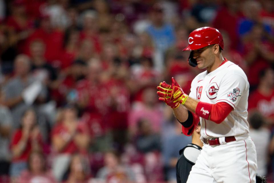 Cincinnati Reds first baseman Joey Votto (19) claps after hitting a 2-run home run in the fifth inning of the MLB baseball game between the Cincinnati Reds and the Miami Marlins on Friday, Aug. 20, 2021, at Great American Ball Park in Cincinnati. 