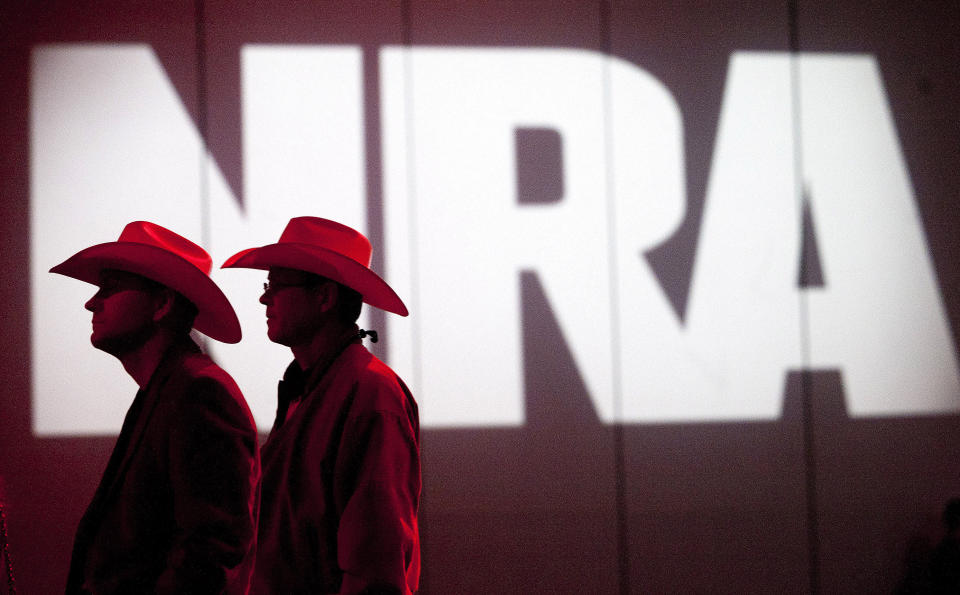 FILE - In this May 4, 2013, file photo, NRA members listen to speakers during the NRA Annual Meeting of Members at the National Rifle Association's 142 Annual Meetings and Exhibits in the George R. Brown Convention Center in Houston. The National Rifle Association is gathering for its 148th annual meeting beginning Thursday, April 25, 2019, in Indianapolis. (Johnny Hanson/Houston Chronicle via AP, File)