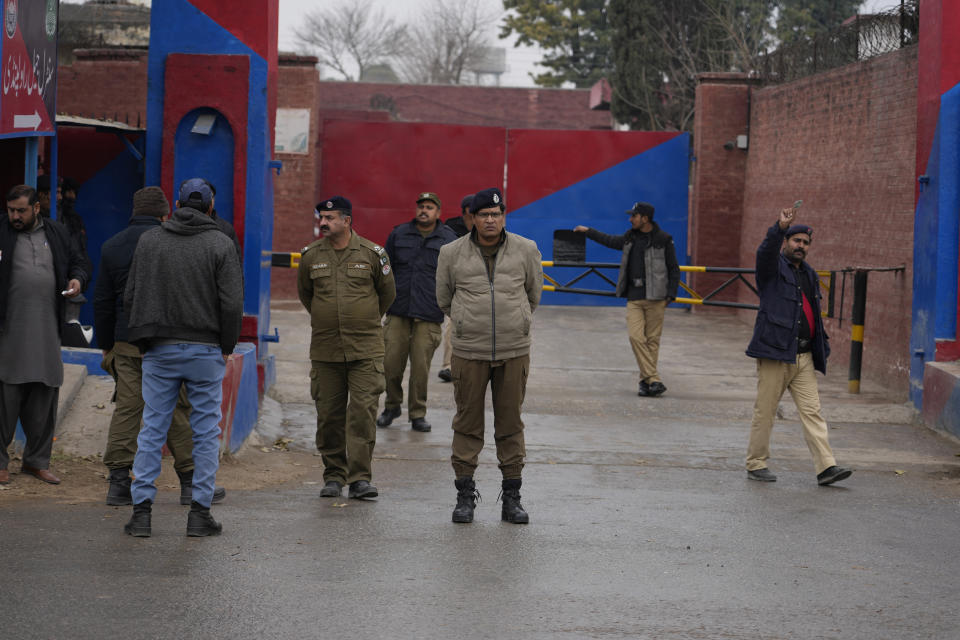 Police officers stand guard outside the Adiyala prison, where a special court proceeding going on for a case against Pakistan's former Prime Minister Imran Khan, in Rawalpindi, Pakistan, Tuesday, Jan. 30, 2024. A Pakistani court on Tuesday sentenced former Prime Minister Khan and one of his party deputy to 10 years in prison each, after finding them guilty of revealing official secrets. (AP Photo/Anjum Naveed)