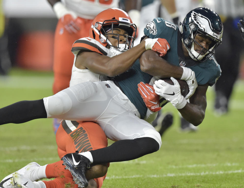 Philadelphia Eagles wide receiver Shelton Gibson, right, is tackled by Cleveland Browns cornerback Michael Jordan during the first half of an NFL preseason football game Thursday, Aug. 23, 2018, in Cleveland. (AP Photo/David Richard)