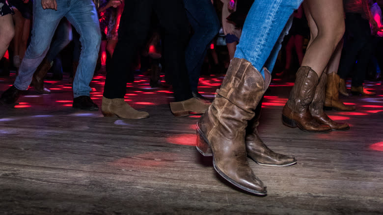 People dancing in cowboy boots