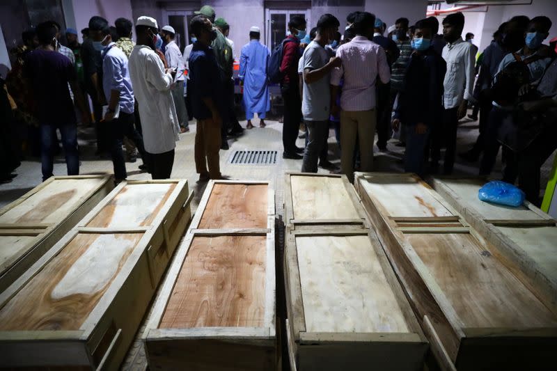 Coffins of victims are seen at a hospital, after a gas pipeline blast at a mosque in Narayanganj