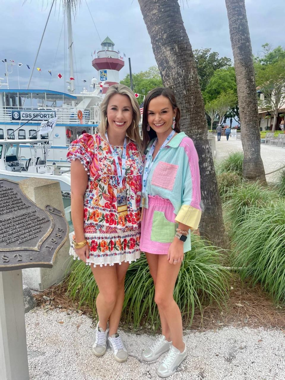 Local residents Olivia Wall and Katelyn Nickles show off their attire in Harbour Town on their way into the tournament on Thursday, April 13, 2023.