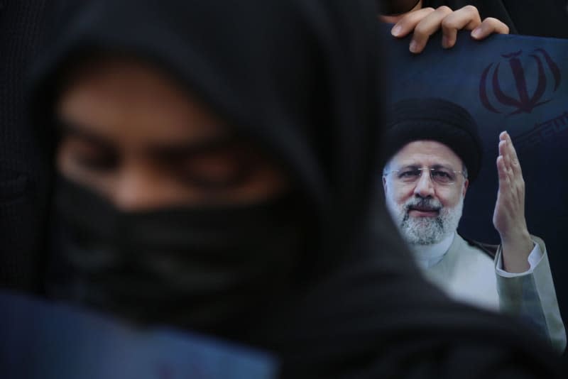 Iranians gather at the Valiasr square during a mourning ceremony for deceased Iranian President Ebrahim Raisi in downtown Tehran. Iranian President Ebrahim Raisi, Foreign Minister Hossein Amir-Abdollahian, and other Iranian officials have lost their lives in a helicopter crash on Sunday in Iran. Rouzbeh Fouladi/ZUMA Press Wire/dpa