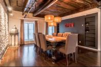 <p>The sleek contemporary furnishings include a well-appointed dining room. (Airbnb) </p>