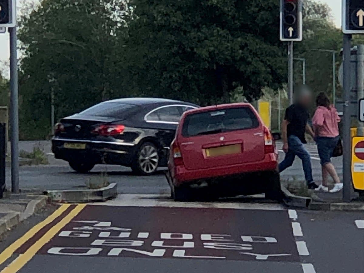 A car getting stuck in the bus lane trap at the junction of Station Road and Harrison Way in St Ives (SWNS)