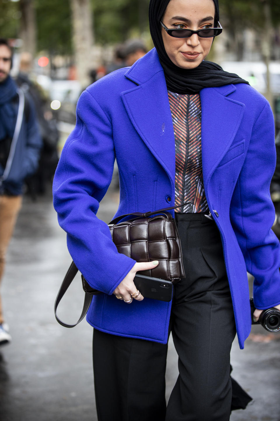 PARIS, FRANCE - SEPTEMBER 25: Leena Al Ghouti, wearing a blue blazer, dark grey pants and brown Bottega Veneta bag, is seen outside the Mugler show during Paris Fashion Week - Womenswear Spring Summer 2020 on September 25, 2019 in Paris, France. (Photo by Claudio Lavenia/Getty Images)