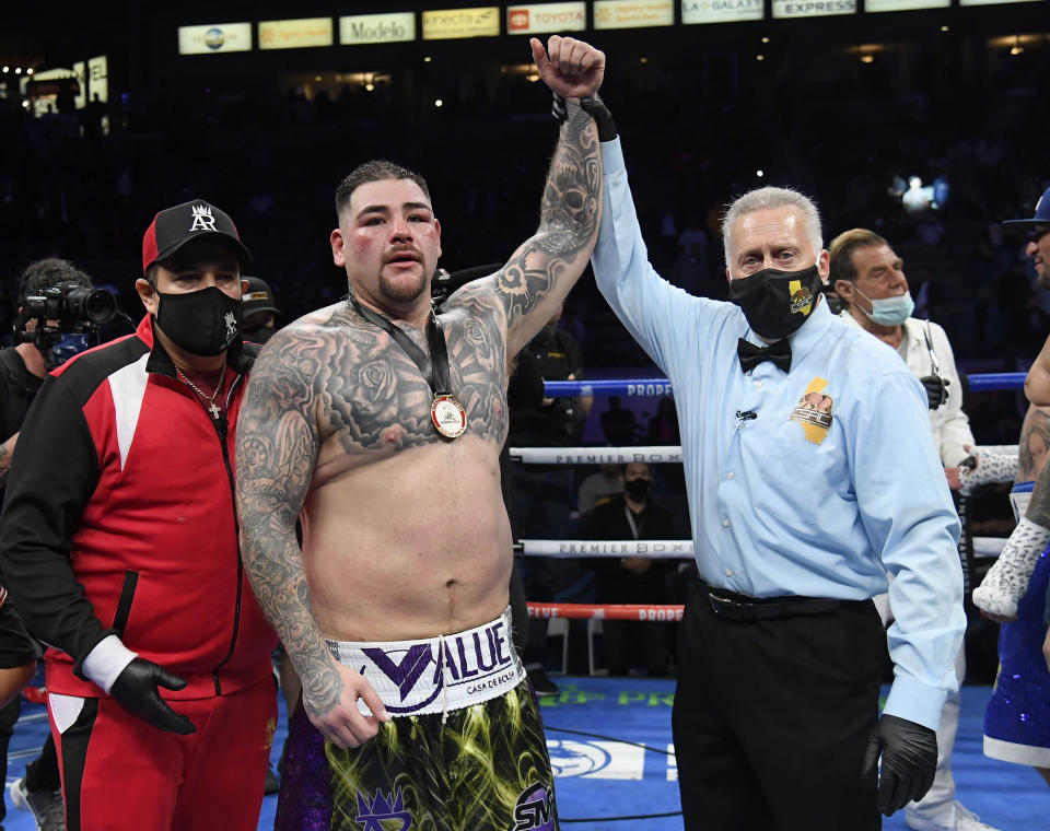 CARSON, CALIFORNIA - MAY 01: Andy Ruiz celebrates his win as he has his hand raised by referee Jack Reiss after a 12 round unanimous decision over Chris Arreola, during a heavyweight bout at Dignity Health Sports Park on May 01, 2021 in Carson, California. (Photo by Harry How/Getty Images)
