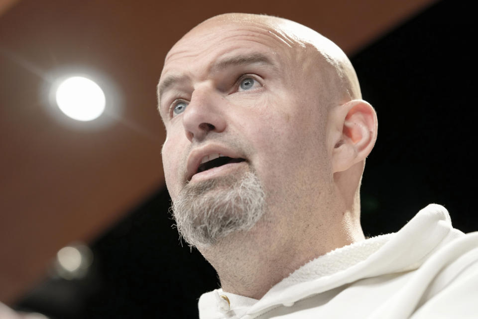 FILE - Sen. John Fetterman, D-Pa., speaks during a news conference on the debt limit, Thursday, May 18, 2023, on Capitol Hill in Washington. Before Fetterman checked himself in to the hospital for clinical depression in February, he walked the halls of the Senate stony-faced and dressed in formal suits. These days, he’s back to wearing the hoodies and gym shorts he was known for before he became a senator. (AP Photo/Mariam Zuhaib, File)