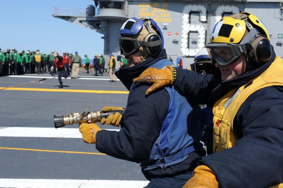 Navy aviation boatswains mate firehose aircraft carrier Eisenhower