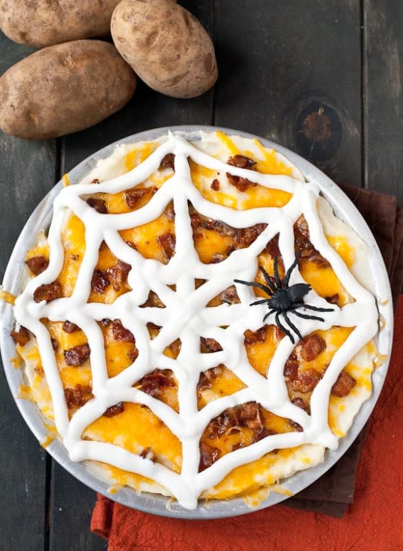 <p>Neighborfood</p><p>Load those mashers with savory toppings and scary decorations.</p><p><strong>Get the recipe: <a href="http://neighborfoodblog.com/2014/09/loaded-mashed-potato-casserole.html" rel="nofollow noopener" target="_blank" data-ylk="slk:Loaded Mashed Potato Casserole;elm:context_link;itc:0;sec:content-canvas" class="link rapid-noclick-resp">Loaded Mashed Potato Casserole</a></strong></p>