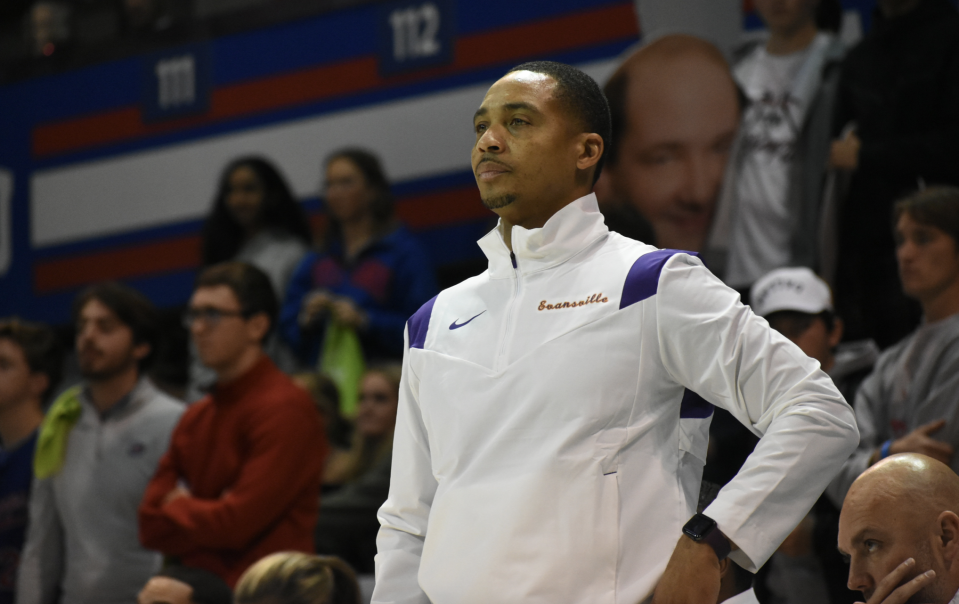 Evansville men's basketball coach watches on as his team faces SMU.