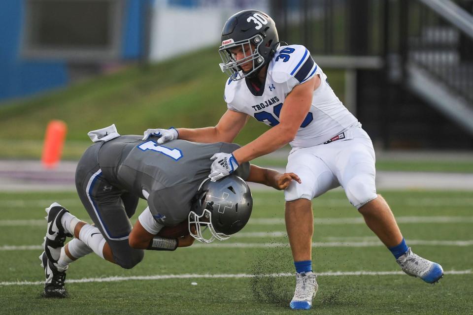 West Central's Jackson McGraw (30) pulls on SF Christian's Lincoln Prins at USF Sports Complex in Sioux Falls, South Dakota on Friday, Sept. 1, 2023.