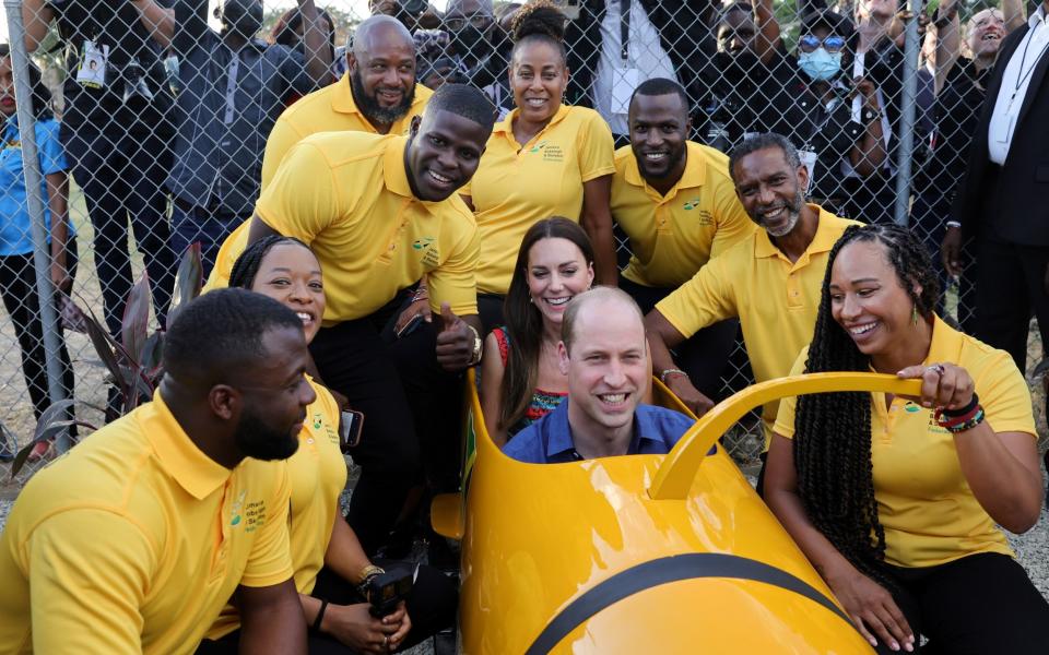 Prince William and Catherine in a bobsleigh during their Caribbean tour