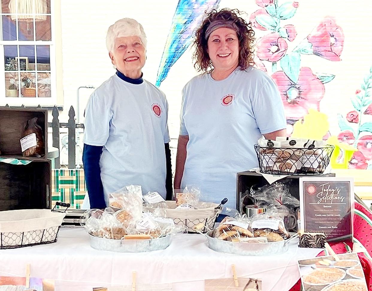 Cathy Knapp, right, and her mom, Erma Mecklenburg, selling baked goods at the farmers market in downtown Sturgis.