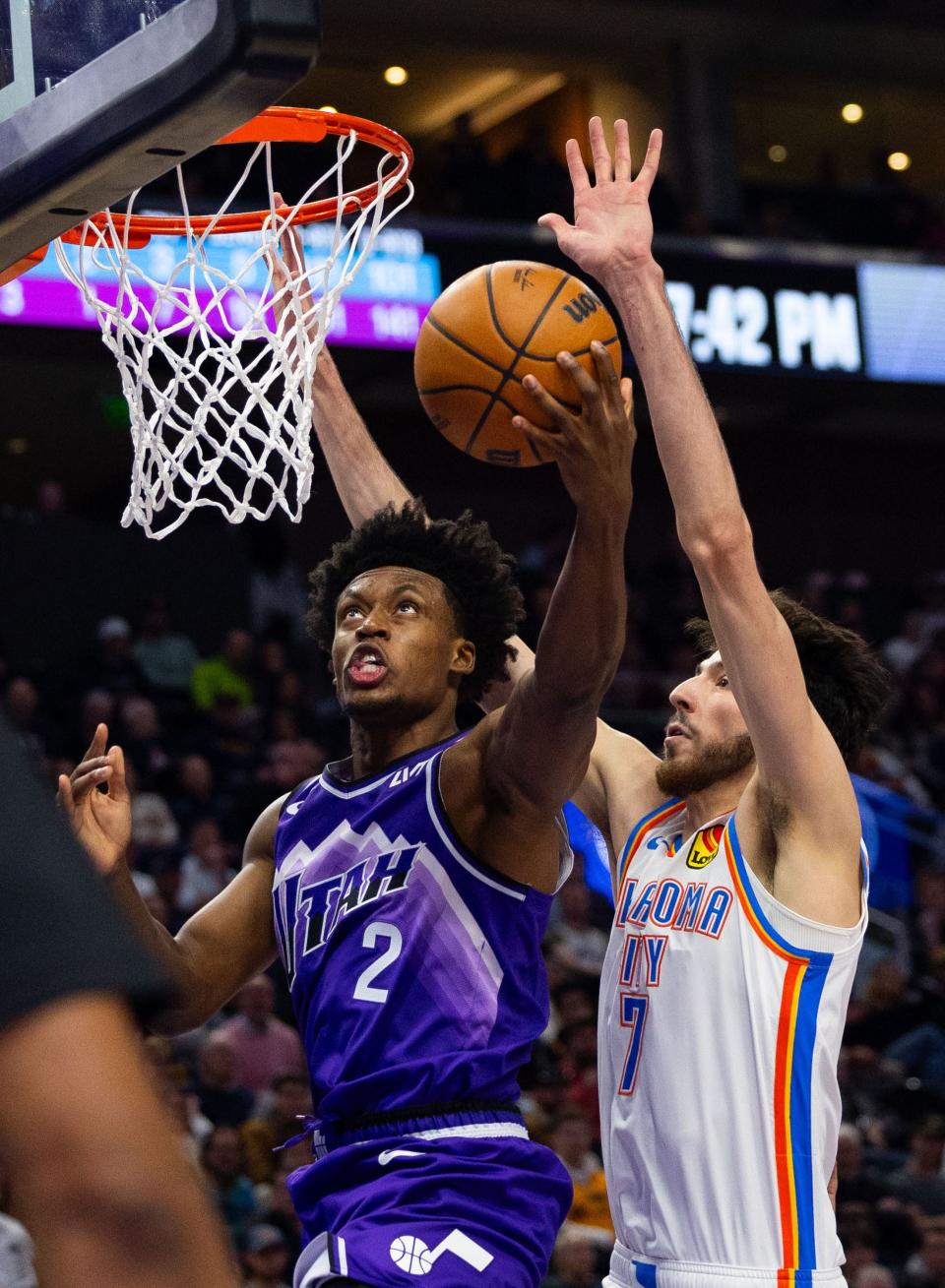 Utah Jazz guard Collin Sexton (2) shoots the ball with Oklahoma City Thunder forward Chet Holmgren (7) on defense during the NBA basketball game between the Utah Jazz and the Oklahoma City Thunder at the Delta Center in Salt Lake City on Thursday, Jan. 18, 2024. | Megan Nielsen, Deseret News