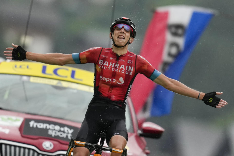 Belgium's Dylan Teuns celebrates as he crosses the finish line to win the eighth stage of the Tour de France cycling race over 150.8 kilometers (93.7 miles) with start in Oyonnax and finish in Le Grand-Bornand, France,Saturday, July 3, 2021. (AP Photo/Daniel Cole)