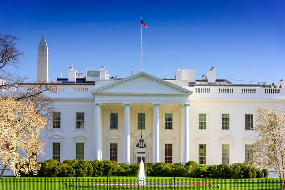 White House from the north side, with top of Washington Monument visible behind it.