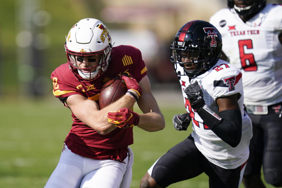 Iowa State wide receiver Landen Akers runs from Texas Tech defensive back Alex Hogan, right, after catching a pass during the first half of an NCAA college football game, Saturday, Oct. 10, 2020, in Ames, Iowa. (AP Photo/Charlie Neibergall)