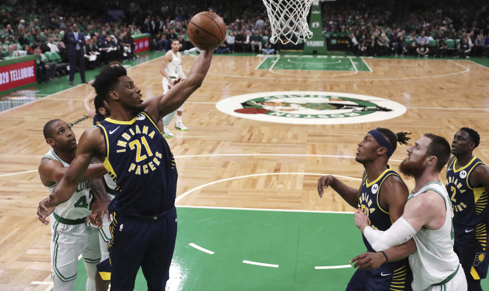 Indiana Pacers forward Thaddeus Young (21) grabs a rebound against the Boston Celtics during the first quarter of Game 2 of an NBA basketball first-round playoff series, Wednesday, April 17, 2019, in Boston. (AP Photo/Charles Krupa)