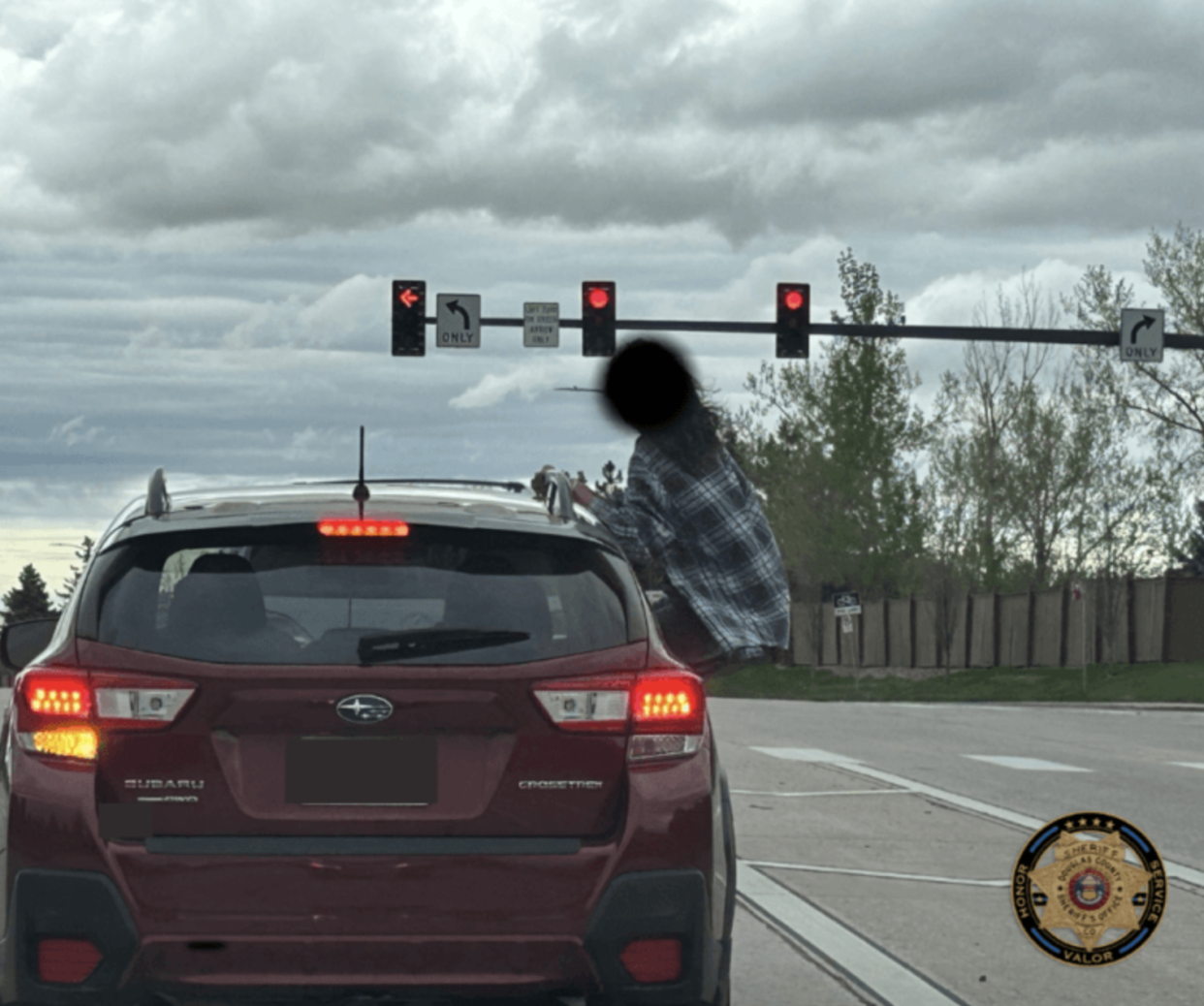 Car surfing (Douglas County Sheriff's Office)