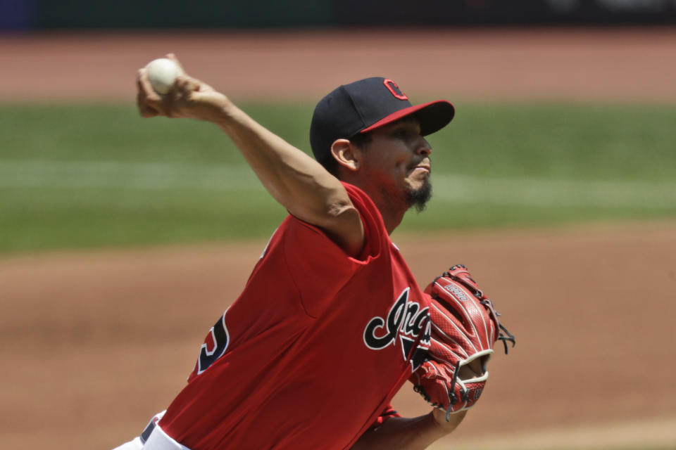 Cleveland Indians starting pitcher Carlos Carrasco delivers in the first inning in a baseball game against the Kansas City Royals, Sunday, July 26, 2020, in Cleveland. (AP Photo/Tony Dejak)