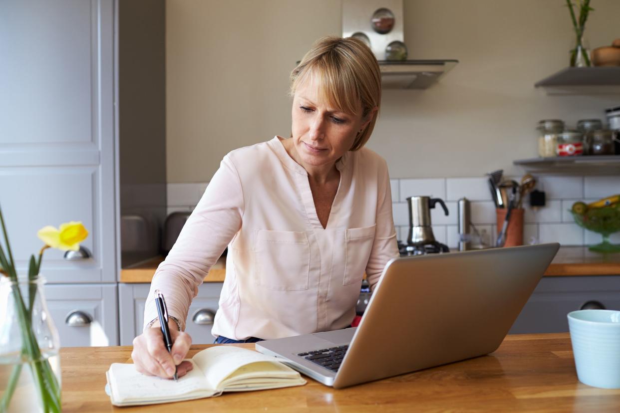 woman working from home on laptop in modern apartment