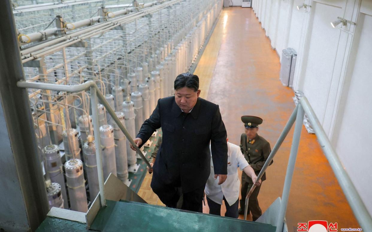 The North Korean leader urged workers to produce more materials for nuclear weapons