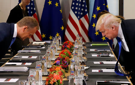 U.S. President Donald Trump (R) and the President of the European Council Donald Tusk take their seats before their meeting at the European Union headquarters in Brussels, Belgium, May 25, 2017. REUTERS/Jonathan Ernst