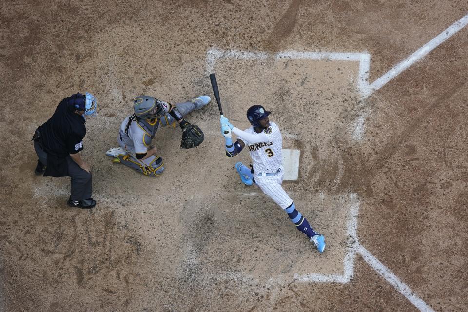 Milwaukee Brewers' Raimel Tapia hits an RBI sacrifice fly during the eighth inning of a baseball game against the Pittsburgh Pirates Sunday, June 18, 2023, in Milwaukee. (AP Photo/Morry Gash)