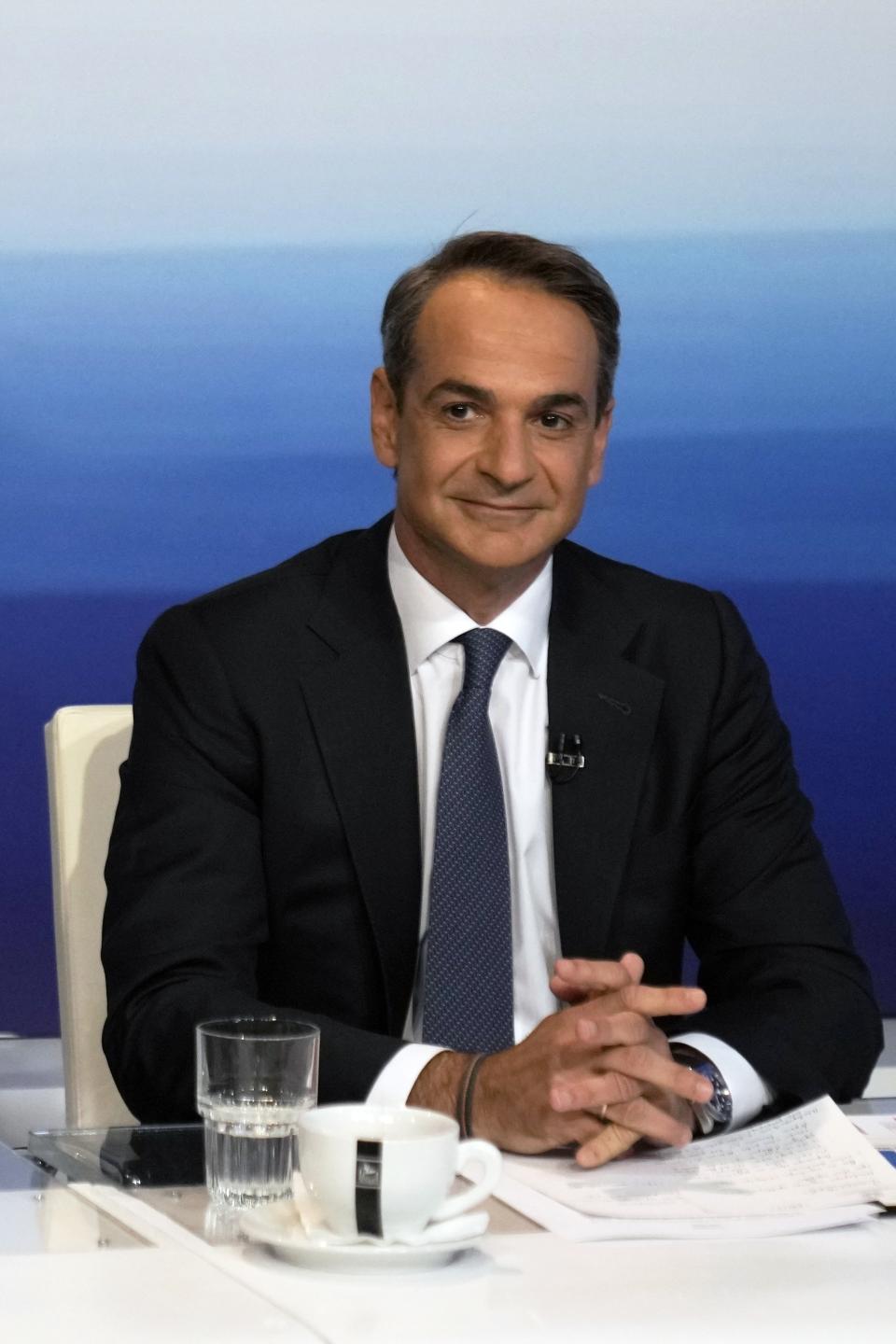 New Democracy leader and Prime Minister Kyriakos Mitsotakis waits for the start of debate at the premises of public broadcaster ERT in Athens, Greece, Wednesday, May 10, 2023. Sunday’s Greek parliamentary election looks likely to be a dress rehearsal for a new round of voting in the busy summer tourist season — barring a surprise coalition deal by dissonant opposition parties. Opinion polls indicate that Prime Minister Kyriakos Mitsotakis' center-right New Democracy could rake in about 35%, some 6 percentage points ahead of leftwing former prime minister Alexis Tsipras' Syriza party. (AP Photo/Thanassis Stavrakis)
