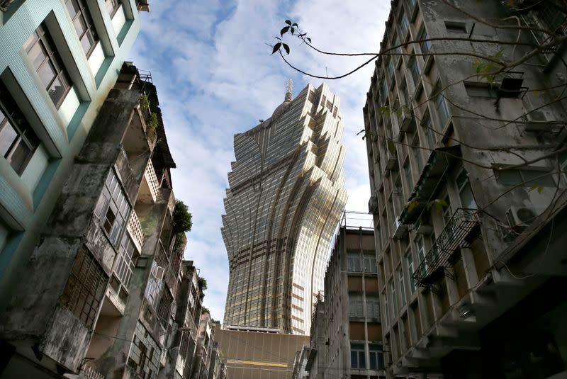 The Grand Lisboa hotel is seen near old apartment blocks in Macau