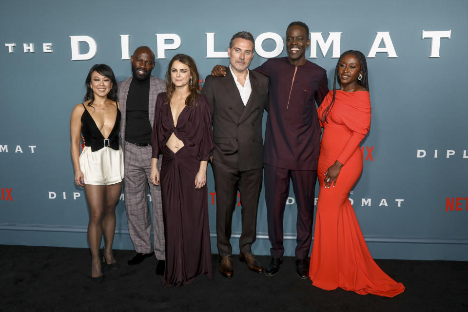 Actors Ali Ahn, from left, David Gyasi, Keri Russell, Rufus Sewell, Ato Essandoh and Nana Mensah attend the premiere of the Netflix series "The Diplomat" at Park Lane New York on Tuesday, April 18, 2023, in New York. (Photo by Andy Kropa/Invision/AP)