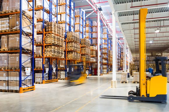 A forklift in a warehouse.