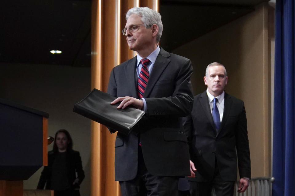 Attorney General Merrick Garland arrives to speak at the Department of Justice in Washington, Thursday, April 13, 2023. Garland announced that a Massachusetts Air National Guard member who has emerged as a main person of interest in the disclosure of highly classified military documents on the Ukraine war was taken into custody Thursday by federal agents. FBI Deputy Director Paul Abbate follows at right. (AP Photo/Evan Vucci)