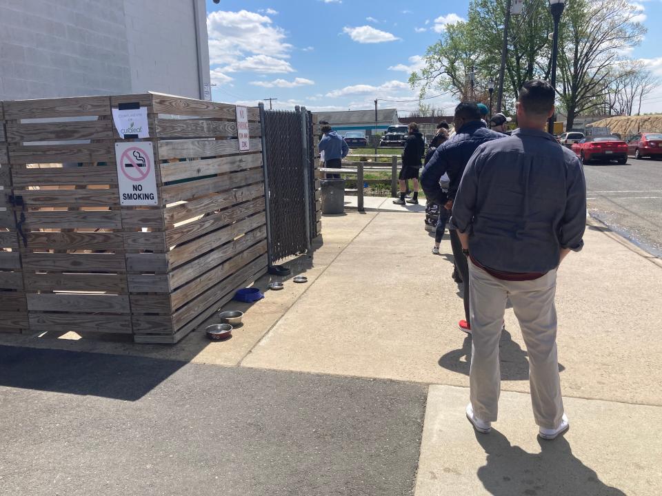 About 100 people stand in line waiting to purchase cannibis at Curaleaf in Bellmawr, N.j. Most waiting in line said they were getting the smoke to deal with anxiety.