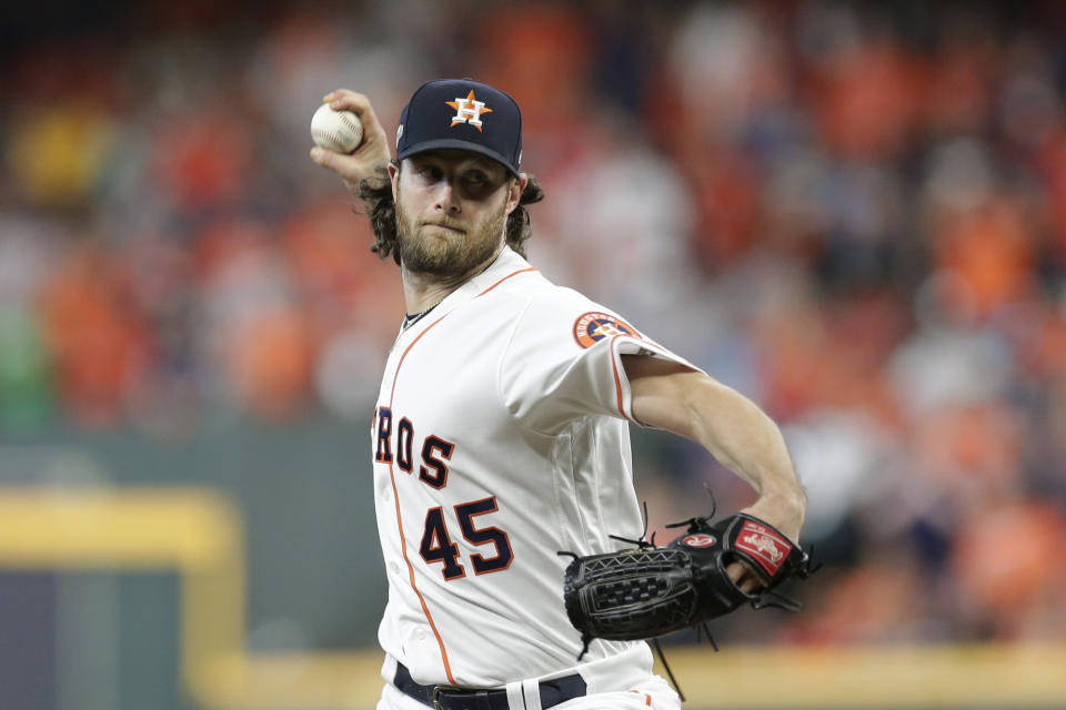 Houston Astros starting pitcher Gerrit Cole (45) pitches against the Tampa Bay Rays during the first inning of Game 5 of a baseball American League Division Series in Houston, Thursday, Oct. 10, 2019. (AP Photo/Michael Wyke)