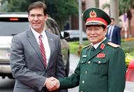 U.S. Defense Secretary Mark Esper poses for a photo with Vietnam's Defence Minister General Ngo Xuan Lich in Hanoi