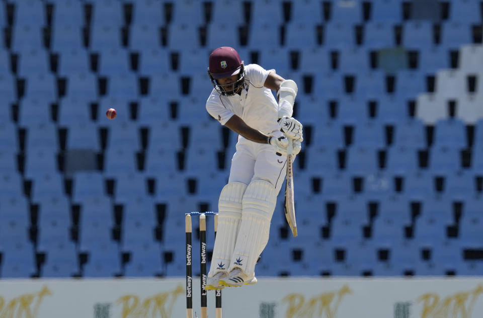 West Indies's captain Kraigg Brathwaite jumps as he misplays a delivery from South Africa's bowler Marco Jansen during the second day of the first test cricket match between South Africa and West Indies, at Centurion Park in Pretoria, South Africa, Wednesday, March 1, 2023. (AP Photo/Themba Hadebe)