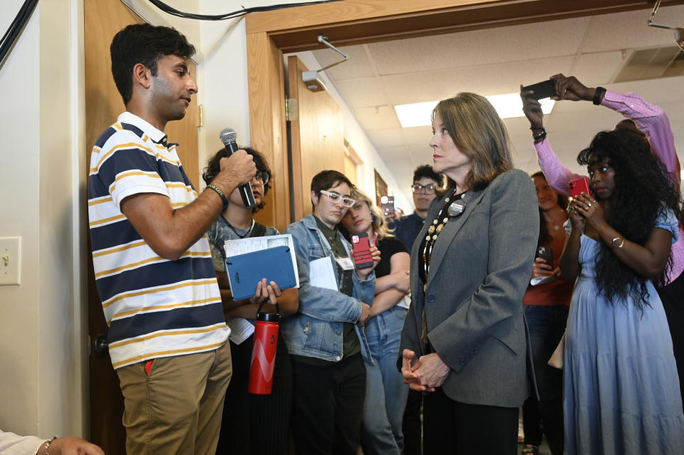 Democratic presidential candidate Marianne Williamson, second from right, answers a question from University of Michigan senior Mahi Vyas, 20, at The Interfaith Center for Spiritual Growth, Sunday, Sept. 10, 2023, in Ann Arbor, Mich. (AP Photo/Jose Juarez)