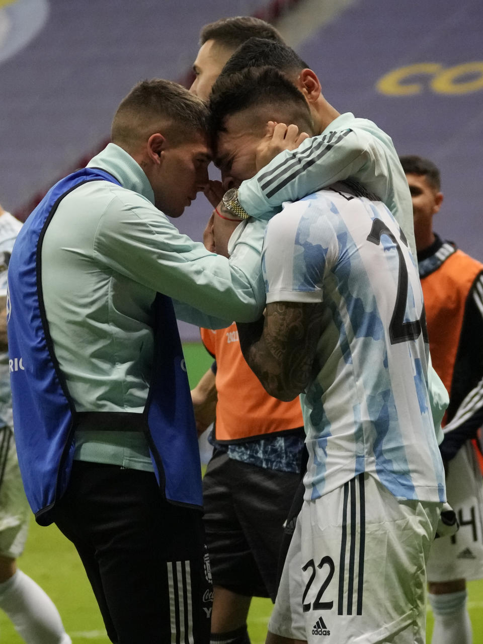 Argentina's Lautaro Martinez celebrates with teammates defeating Colombia in a penalty shootout during a Copa America semifinal soccer match at the National stadium in Brasilia, Brazil, Wednesday, July 7, 2021. (AP Photo/Andre Penner)