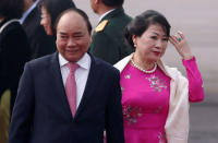 Vietnam's Prime Minister Nguyen Xuan Phuc and his wife Tran Thi Nguyet Thu walk toward their car after their arrival at Air Force Station Palam in New Delhi, India, January 24, 2018. REUTERS/Adnan Abidi