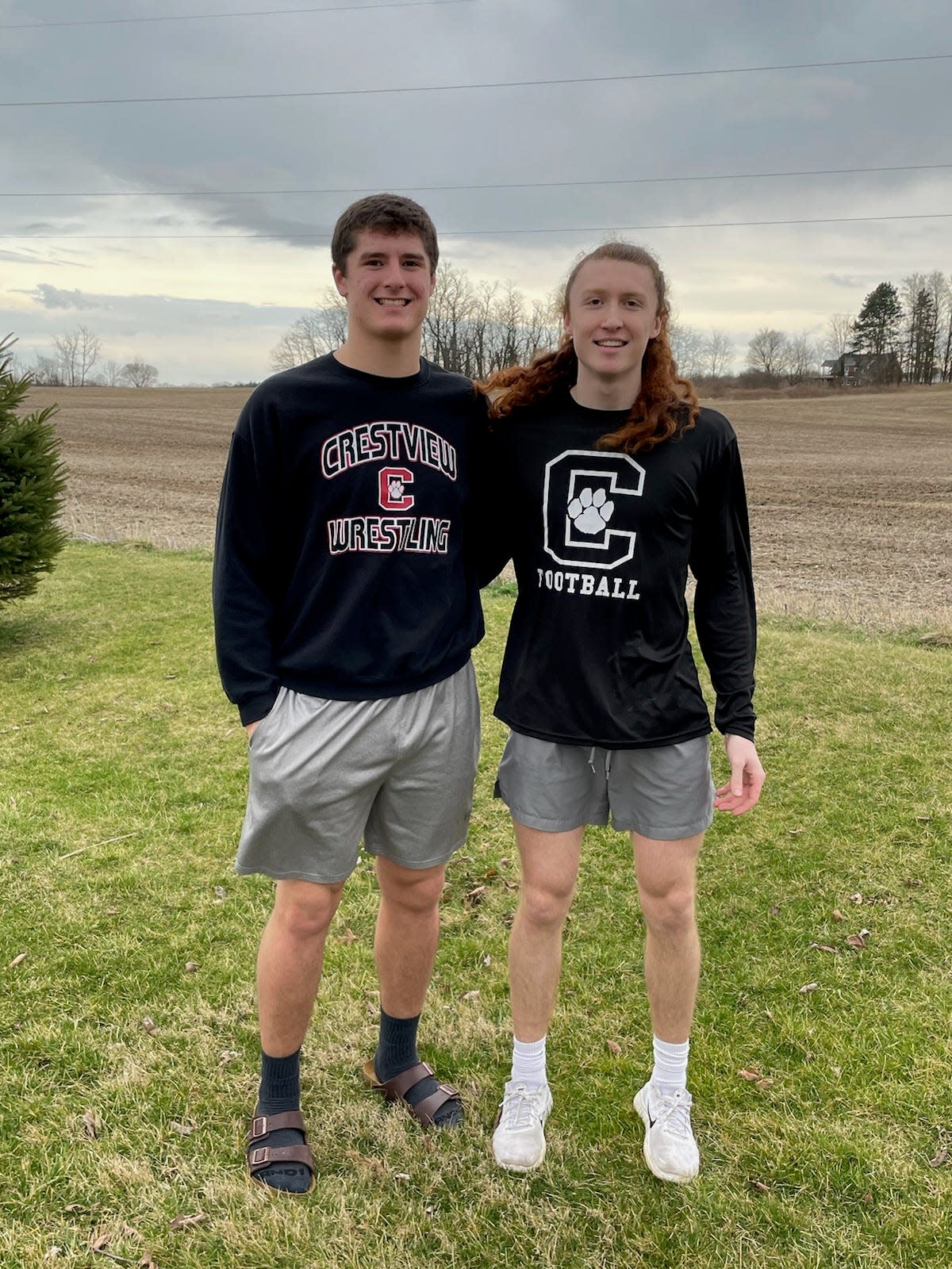 Caleb Cunningham (left) is favored to win a state heavyweight title, which would match the state track title his brother Caden (right) won as a member of Crestview’s 4x400 relay team last spring.