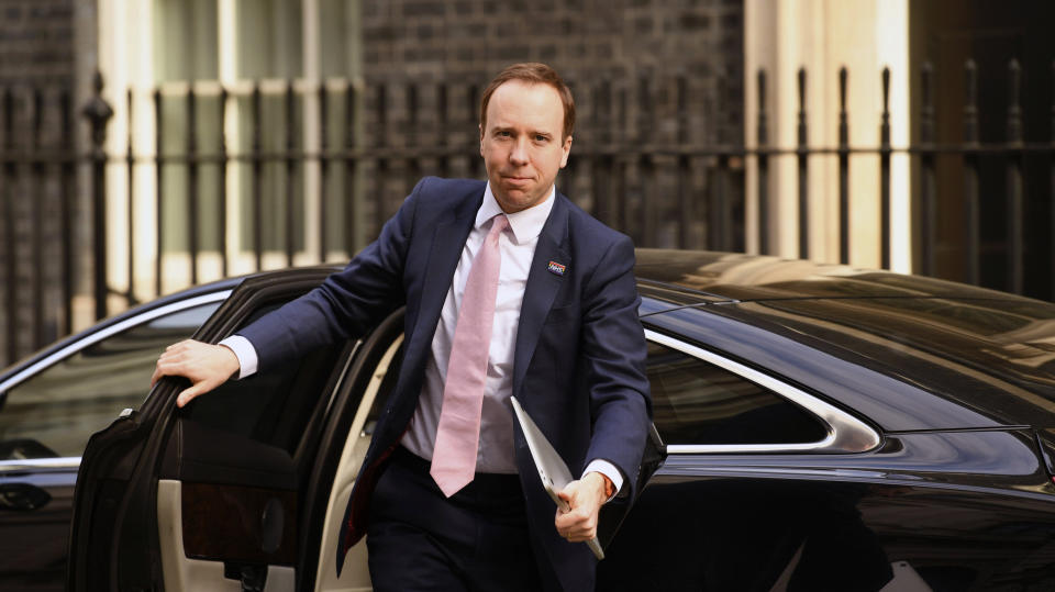 Britain's Health Secretary Matt Hancock arrives in Downing Street, London, Tuesday April 14, 2020. Prime Minister Boris Johnson remains in convalescence at his country home of Chequers, following his hospialisation with the coronavirus. The highly contagious COVID-19 coronavirus has impacted on nations around the globe, many imposing self isolation and exercising social distancing when people move from their homes. (Stefan Rousseau / PA via AP)