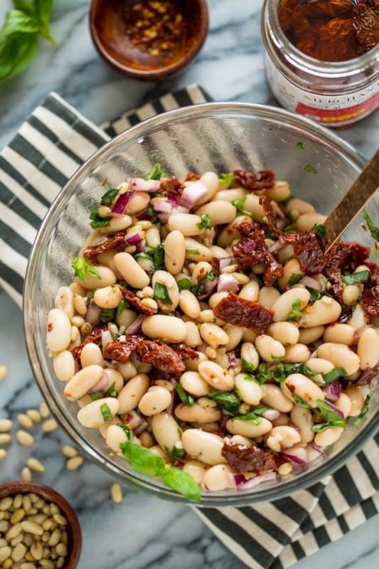 <p>A Saucy Kitchen</p><p>Creamy, punchy and tangy sun dried tomato and cannellini bean salad – make in 15 minutes or less with minimal prep! Serve as a simple side, as a snack or starter with bread or crackers or enjoy as a light lunch or dinner.</p><p><strong>Get the recipe: <a href="https://www.asaucykitchen.com/cannellini-bean-salad/" rel="nofollow noopener" target="_blank" data-ylk="slk:Sun Dried Tomato and Cannellini Bean Salad;elm:context_link;itc:0;sec:content-canvas" class="link rapid-noclick-resp"><em>Sun Dried Tomato and Cannellini Bean Salad</em></a></strong></p>