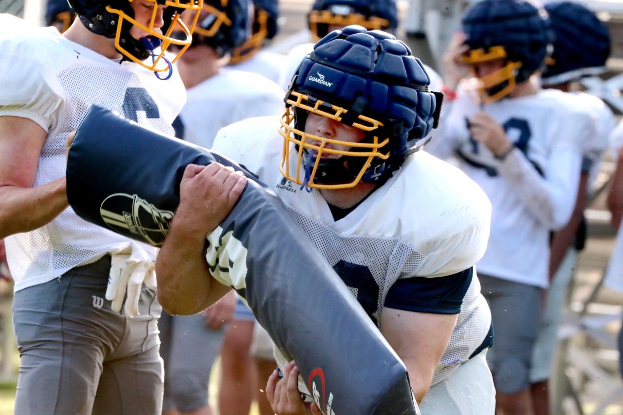 PCA's Walker Boyd (73) runs through a drill during the first football practice in pads for the season on Monday, July 24, 2023.