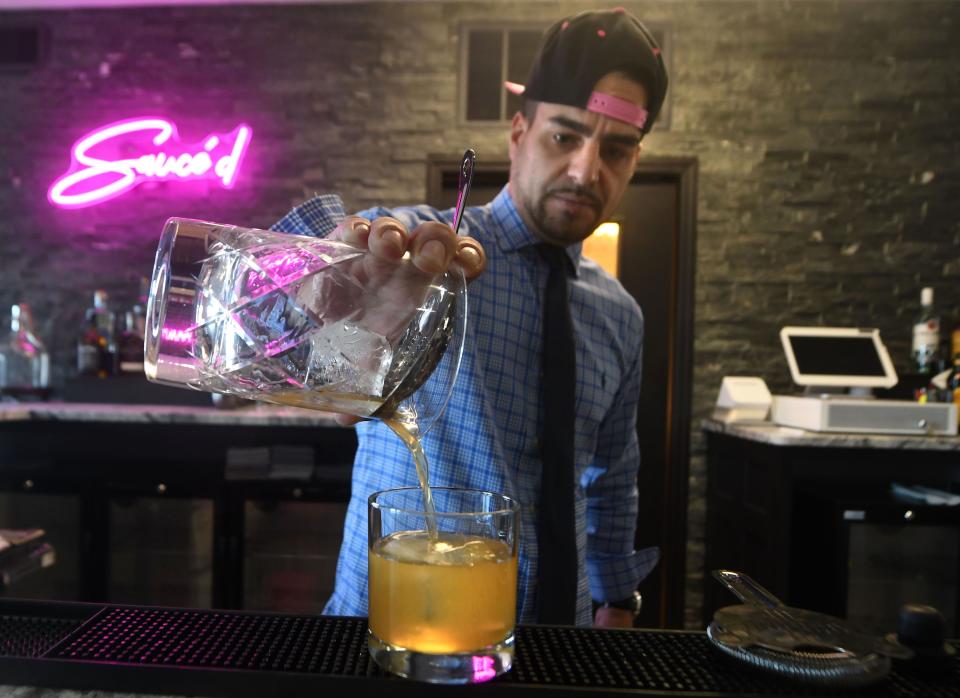 Jeremiah Ramos makes a cocktail at Sauce'd at 224 S Water St. in downtown Wilmington, N.C. STARNEWS FILE PHOTO